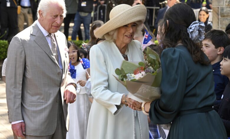 Children greet King Charles III and Queen Camilla outside a Sydney church Children greet King Charles III and Queen Camilla outside a Sydney church