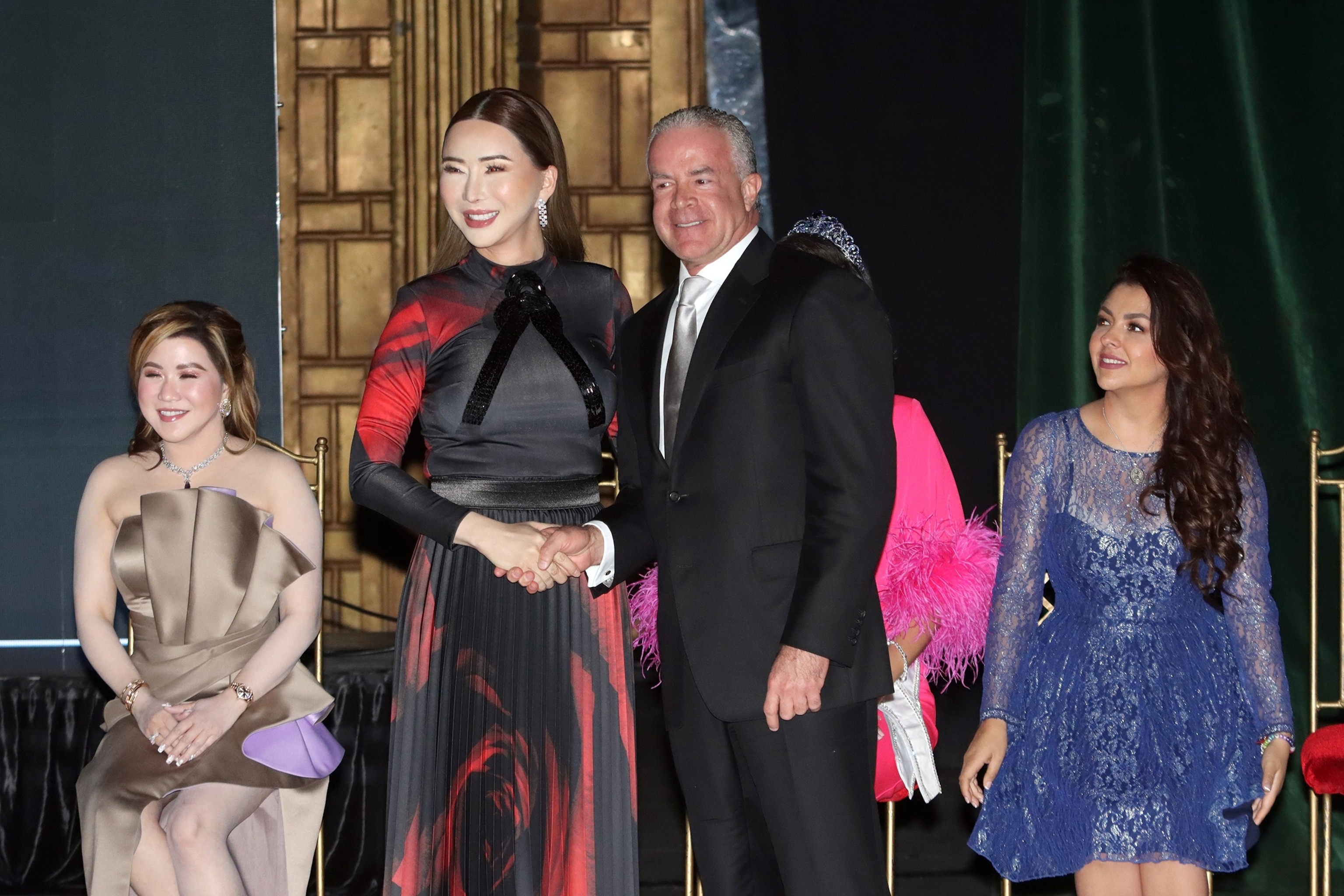 PHOTO: Founder of JKN Global Group Anne Jakkaphong and president of the board of directors of Legacy Holdings Raul Rocha shake hands during a press conference with the organizing committee of the Miss Universe 2024, Jan. 23, 2024, in Mexico City.