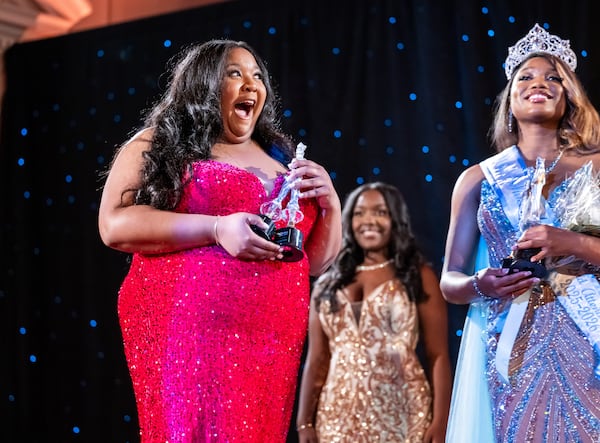 250412 ATLANTA, GA — Chelsea Benton, left, reacts as she is announces first attendant during the 42nd annual Miss Spelman pageant at Spelman College’s Sisters Chapel in Atlanta on Saturday, April 12, 2025. (Bita Honarvar for The Atlanta Journal-Constitution)