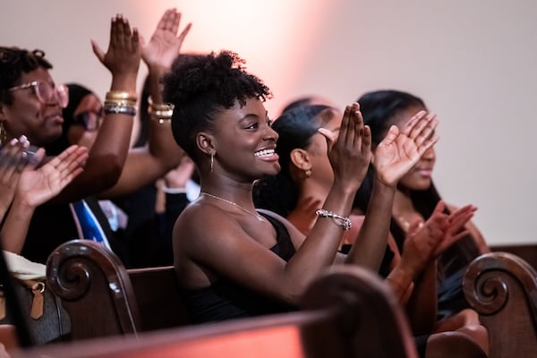 250412 ATLANTA, GA — 2023 Miss Spelman third attendant Nadia Scott applauds during the 42nd annual Miss Spelman pageant at Spelman College’s Sisters Chapel in Atlanta on Saturday, April 12, 2025. (Bita Honarvar for The Atlanta Journal-Constitution)